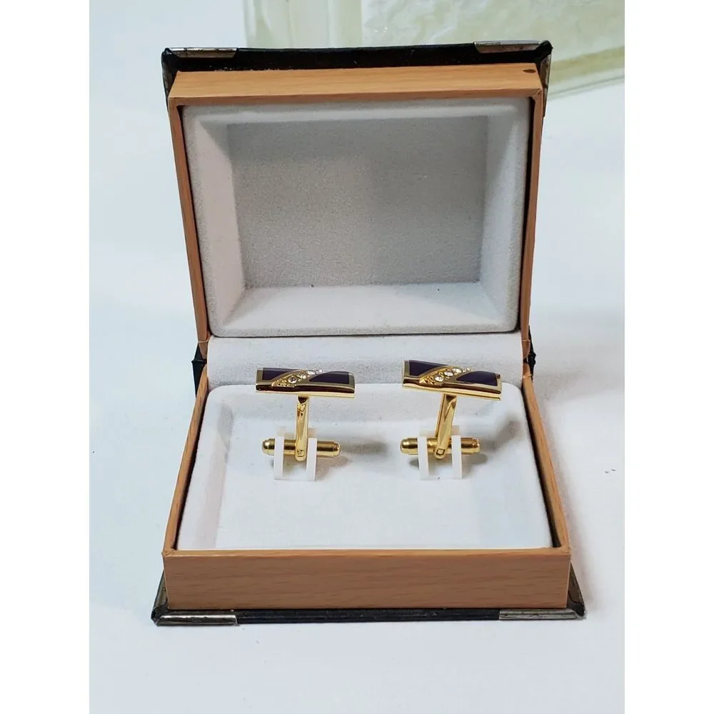 The Cufflinks are gold-toned with purple inlay Great Gift